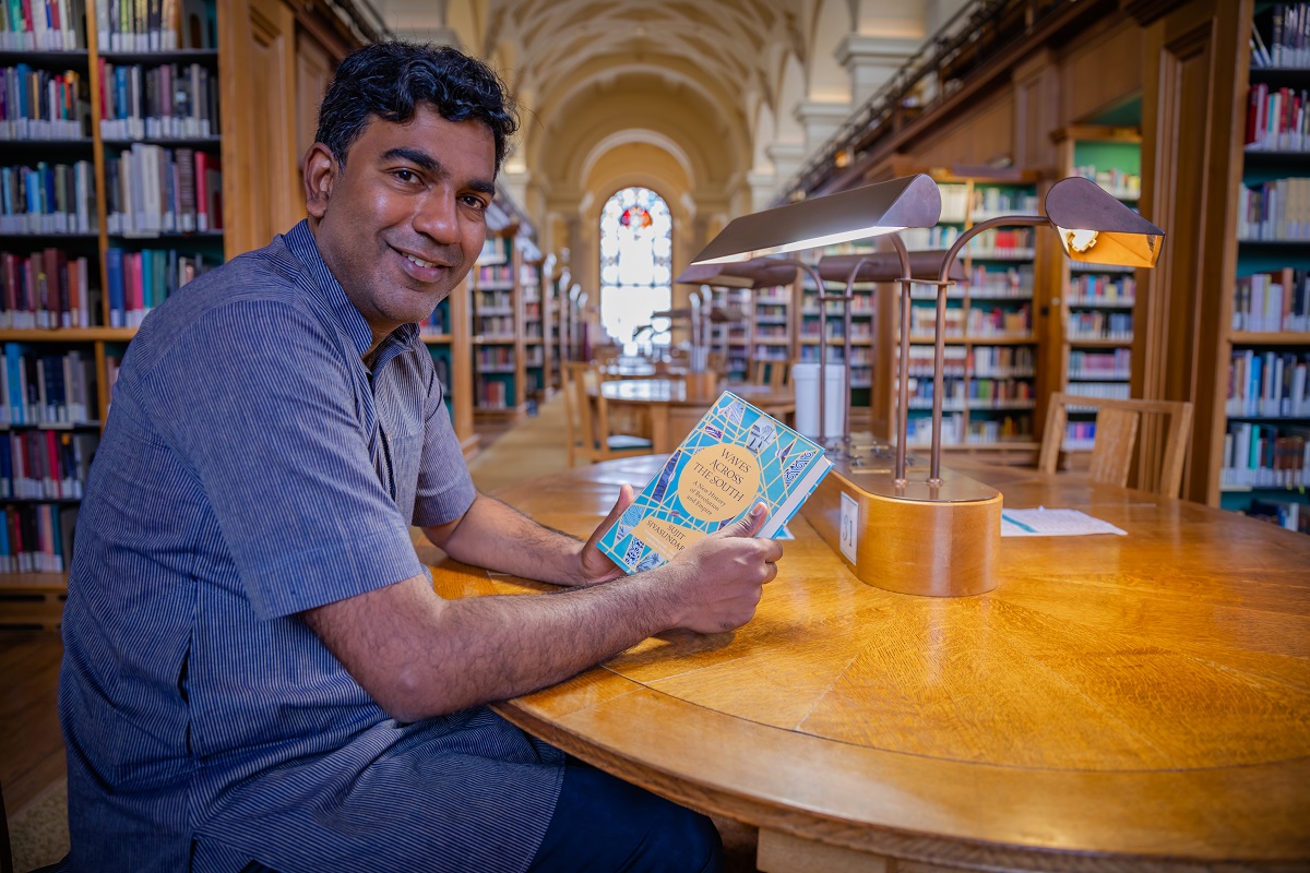 Professor Sujit Sivasundaram with his book
