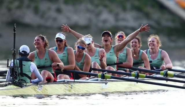 women rowing celebration
