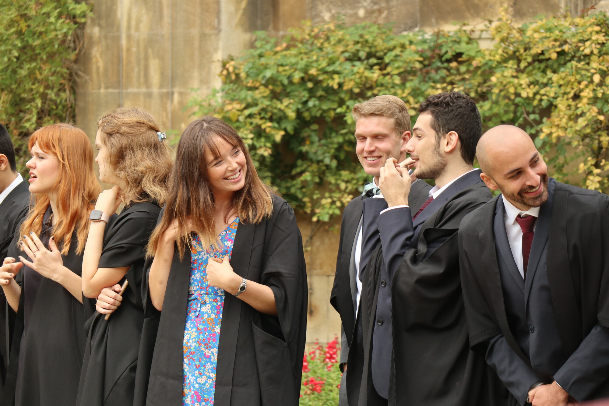 Postgraduate students in academic gowns